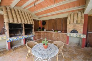 A kitchen or kitchenette at L'Albaida, tranquility, views of sea and mountains