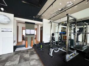 a room with a gym with tread machines in it at Time Camp 高輪 in Tokyo