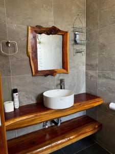 a bathroom with a sink and a mirror at Cottage Ragati in Nanyuki +19 photos