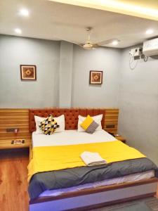 The Promise Hotel and Resort客房内的一张或多张床位