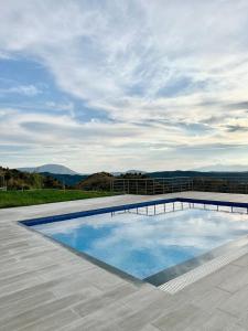 a swimming pool on top of a house at Villa Panorama in Sarandë