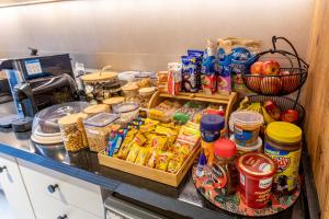 a kitchen counter with a bunch of food on it at Casa Savana in São Paulo