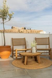 a table and two chairs and a table and a table sidx sidx sidx at The Minion Elegant Suite - Acropolis View in Athens