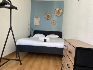 En eller flere senge i et værelse på Le Tolstoï