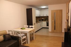 a living room and kitchen with a table and a couch at Perspective View in Veliko Tŭrnovo