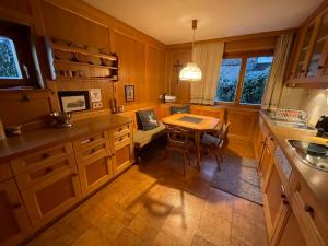 a kitchen with a table and a dining room at Haus Kilian in Schruns-Tschagguns