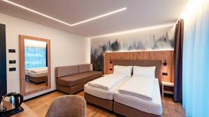 Postel nebo postele na pokoji v ubytování Dolomites Room and Breakfast Formiè