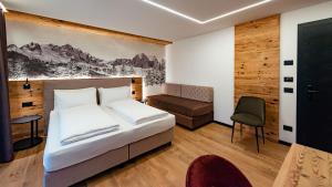 Postel nebo postele na pokoji v ubytování Dolomites Room and Breakfast Formiè