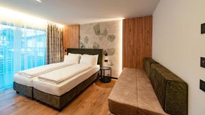 Postel nebo postele na pokoji v ubytování Dolomites Room and Breakfast Formiè