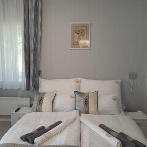 Postel nebo postele na pokoji v ubytování Mátra Gold Vendégház
