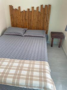 Una cama o camas en una habitación de Posada Lili