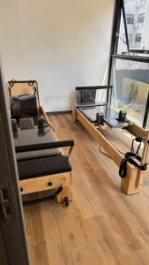 a room with two beds and a large window at Fit 26 26 de marzo 3330 in Montevideo +29 photos