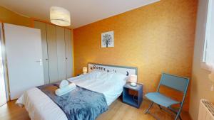 Ένα ή περισσότερα κρεβάτια σε δωμάτιο στο Balcon de la plage