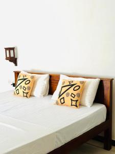 Ένα ή περισσότερα κρεβάτια σε δωμάτιο στο Welcome Family Guest House.