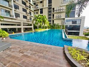 a swimming pool in the middle of a building at MCM Cebu Staycation at Base Line Premier in Cebu City