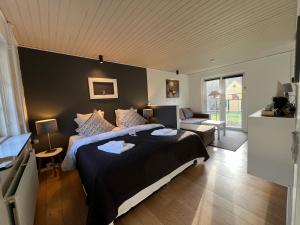 Postel nebo postele na pokoji v ubytování Hotel Skovly