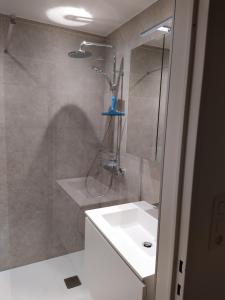 a bathroom with a shower and a sink at Residentie Rapallo in Middelkerke +17 photos