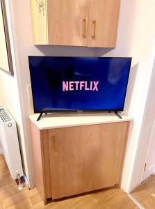 a netflix laptop on top of a table at Harwich - Caravan - Sleeps 10 - Garden - Pool in Harwich