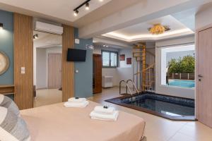 Ένα ή περισσότερα κρεβάτια σε δωμάτιο στο Olive Chrysi Luxury Villa with in-room plunge pool