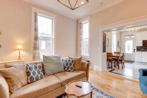 a living room with a couch and a table at Walk to Anheuser-Busch Brewery St Louis Escape! in Soulard