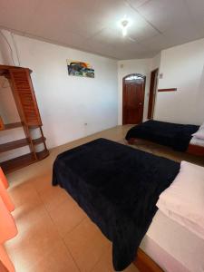 Postel nebo postele na pokoji v ubytování Hostal Neptuno - Poseidon