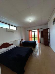 Postel nebo postele na pokoji v ubytování Hostal Neptuno - Poseidon