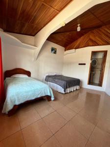 Postel nebo postele na pokoji v ubytování Hostal Neptuno - Poseidon