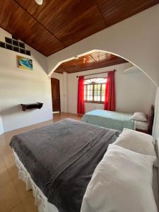 Postel nebo postele na pokoji v ubytování Hostal Neptuno - Poseidon