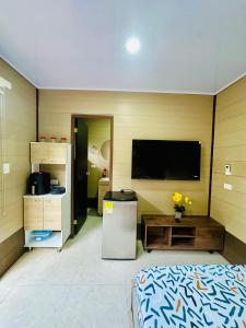 a room with a flat screen tv on the wall at Glamping Arena in El Porvenir +22 photos