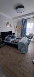 Postel nebo postele na pokoji v ubytování Apartament Blue Sky