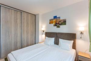 En eller flere senge i et værelse på Corner Apartment Fonyód