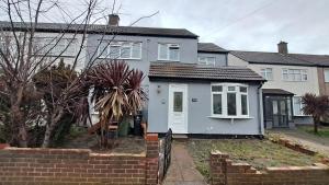 a white house with a white door at Fenia Estate in Barking