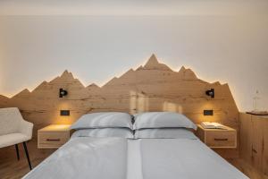 Postel nebo postele na pokoji v ubytování Armonia - Your Alpine Hideaway
