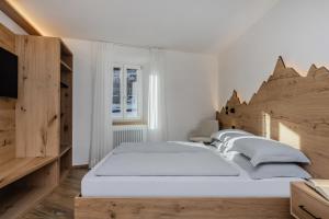 Postel nebo postele na pokoji v ubytování Armonia - Your Alpine Hideaway