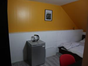 Postel nebo postele na pokoji v ubytování Chambre Jaune