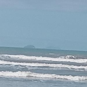 a group of waves in the ocean on a beach at CANTO DO PARAÍSO Praia RUÍNAS in Peruíbe