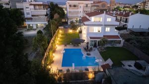 an aerial view of a house with a swimming pool at Sky in Perea