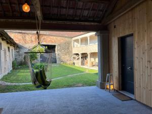 a porch with a hammock hanging from a building at Bella Casa Araujo in Lamas