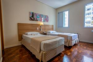 Postel nebo postele na pokoji v ubytování Hotel Amália