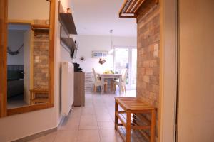 a kitchen and dining room with a table and chairs at Villa am Meer - Antje in Dorum-Neufeld