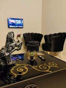 a living room with a table and chairs at Private & Cozy 2-Bedroom Full Apartment for Families E11 Islamabad in Islamabad +18 photos