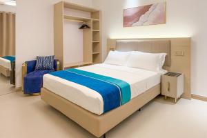Postel nebo postele na pokoji v ubytování Aqua Heaven Inn
