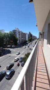 a view of a city street with cars on the road at Hotel Venezia in Mar del Plata