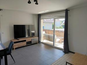 Et tv og/eller underholdning på Apartment in Ville-la-Grand