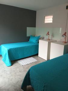 Postel nebo postele na pokoji v ubytování Hostel El Chinchero