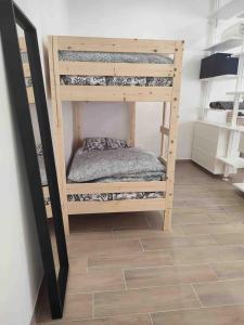 Ένα ή περισσότερα κρεβάτια σε δωμάτιο στο Gaeta rHOMEo