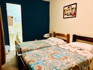 Katil atau katil-katil dalam bilik di HOTEL Ecológico BLUEROCK