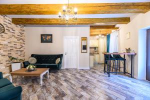 a living room with a couch and a table at Dallure House Boutique Brasov in Braşov