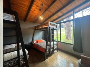Postel nebo postele na pokoji v ubytování Cabaña DAGO