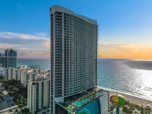an aerial view of a tall building near the ocean at Stunning Beachfront 3-Bedroom Corner Residence in Hollywood
